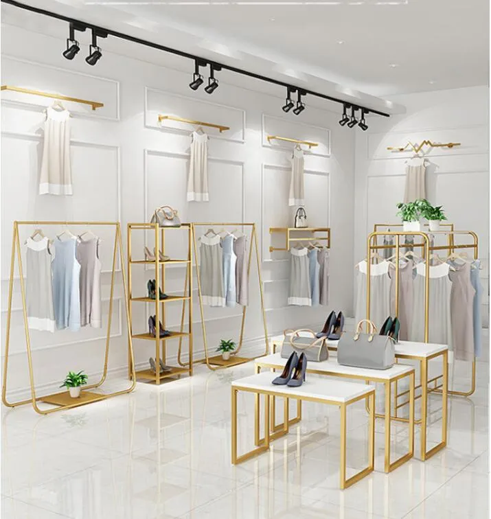 Magasin de vêtements présentoir combinaison de sol or étagère de magasin de tissu pour femmes fer suspendus vêtements racks