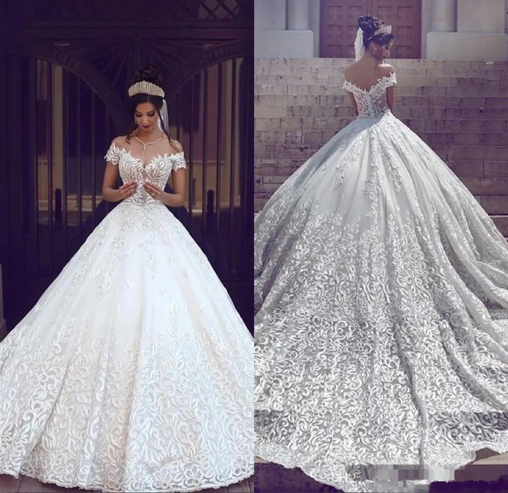 Efektowne sukienki ślubne A Dubai Luksusowe krótkie rękawy z aplikacji ramionowych bez pleców z zamiatającymi pociągami ślubnymi Vestidos de novai