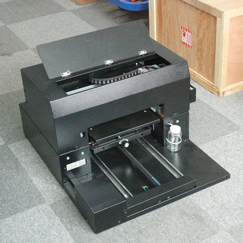 Small uv printer universal tablet custom t-shirt printing machine mobile phone shell pvc production machine1