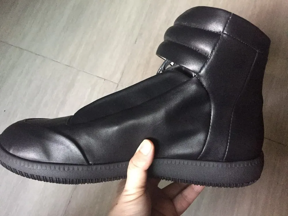 Hombres zapatos casuales Nuevo genuino Leather Boots planos altos Versiones más altas Botas de moda de motocicletas Gran tamaño