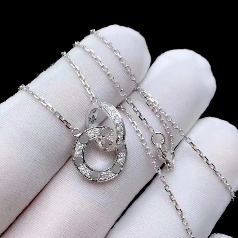 Nowy moda miłosna biżuteria Mężczyźni Kobiety podwójny pierścień pełny otwór dwa rzędy wiertła naszyjnik ośmioboczny śrubowa korek kochanka para prezent321a