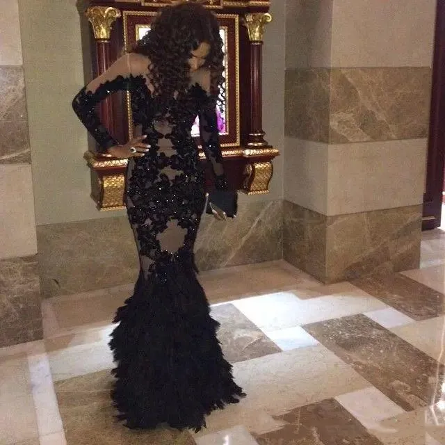 African Sexy Black Mermaid Feather Prom Dresses Floor Length Nude Lining Appliques Lace Beaded Crystals Long Sleeve 2021 Formal Evening Gown