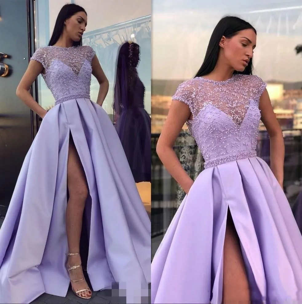 2022 Lavender Lilac Sexy Ball Gown Prom Dresses Jewel Neck Cap Sleeves Lace Appliques Sheer Beads Satin Side Split Hollow Back Sweep Train Evening Party Gowns