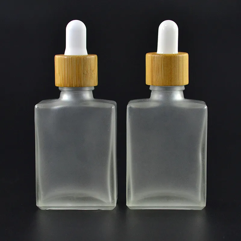 Bouteille d'huile de teinture en verre carré transparent givré écologique avec couvercle compte-gouttes en bambou, 30ML 1OZ 15ml 50ml 100ml Bouteille d'huile essentielle en verre rectangle en gros