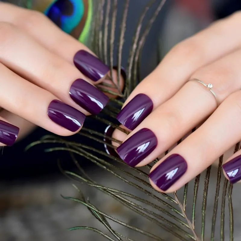 Premium Photo | Hand of the girl. dark purple manicure. long colored acrylic  nails. female manicure and floral patte