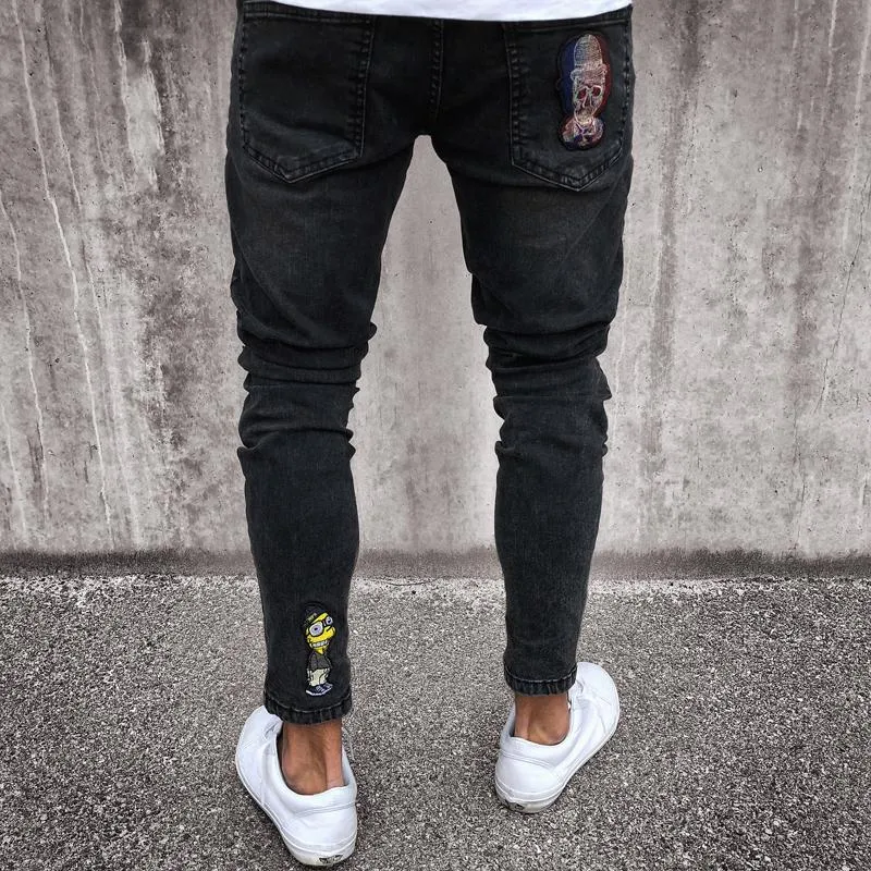 Mäns jeans stretchig rippad mager cyklist jeans tecknad mönster förstört tejpade smala fit svarta denim byxor new263o