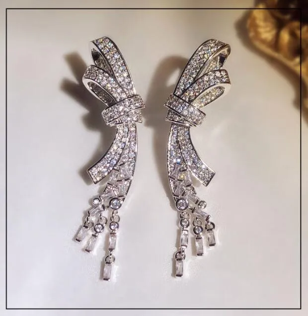 Luxe brillant cristal doux Bowknot Designer boucles d'oreilles long gland pendentif pendentif CZ diamant boucle d'oreille anneaux fête mariage 251p