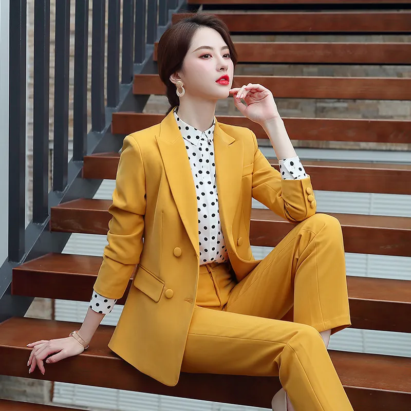 Premium AI Image | a woman in a yellow suit stands in front of a gray  background.