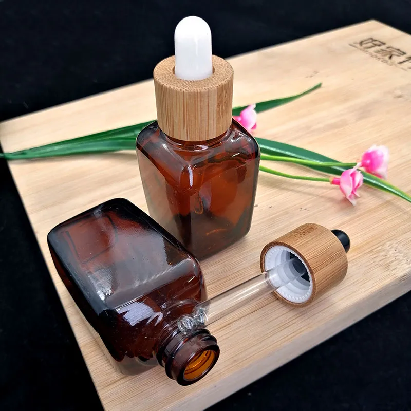30ml bärnstensfärgad fyrkantig droppflaska glasflaska Miljövänlig bambu vit svart lock Kosmetisk eterisk olja aromaterapi Behållarförpackning