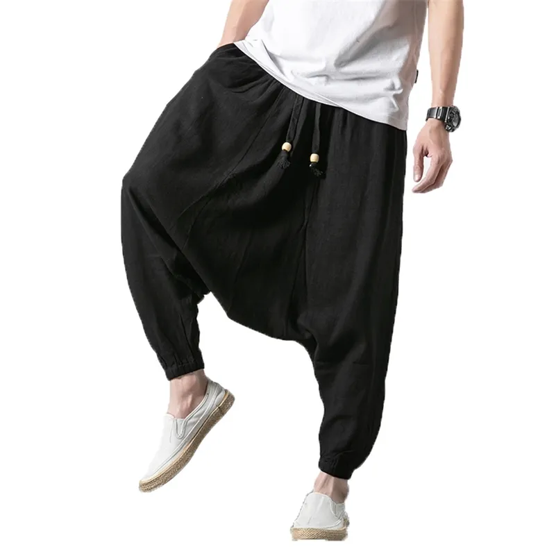 Pantaloni da uomo a gamba larga Pantaloni larghi Harem da uomo Pantaloni neri solidi Pantaloni da uomo HipHop uomo streetwear hip hop lino Pantaloni incrociati 201125