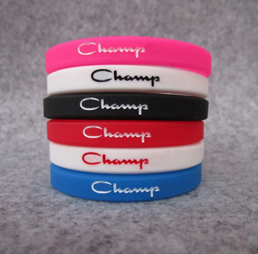 50pcs Silicone Champion Bracelets Bracelets Unisexe Bracelet en caoutchouc coloré Sport Bande de bracelets Fashion Jewelry Promotion Cadeau