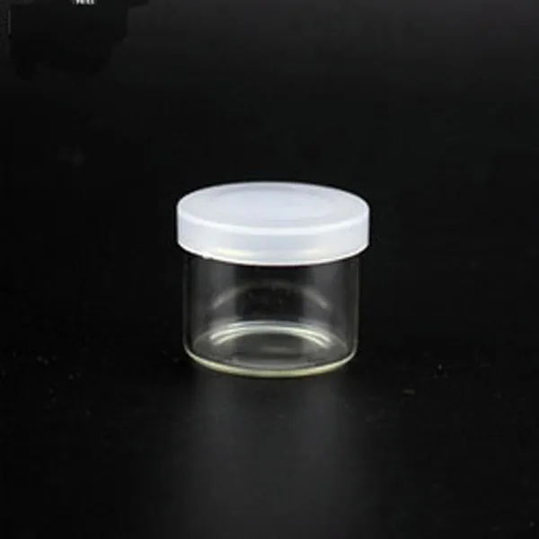 Concentré de haute qualité Mini Jar récipient avec couvercle transparent médecine bouteilles en verre Cire huile Dab Pot