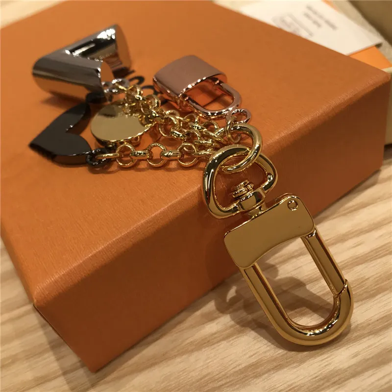 Llavero Diseñador de lujo Gold Metal Key Hebilla Classic Marca letra Rose Lock Star Colgante con estilo Alta Calidad Llaveros Bolsa Adornos
