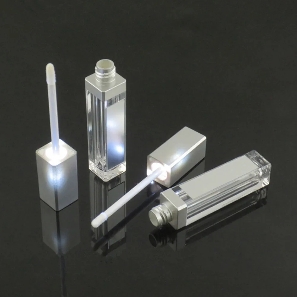 7ml LEDの空のリップ光沢の管の正方形の透明なリップグロスの詰め替え可能なボトル容器のプラスチック化粧包装鏡と光DHL