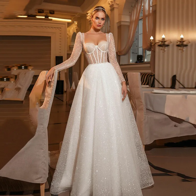 Boho Princess Long dresses for wedding with Glitter Sequin Detailing and Open Back - Shiny Sweetheart Long Sleeve Bridal Gown with Court Train