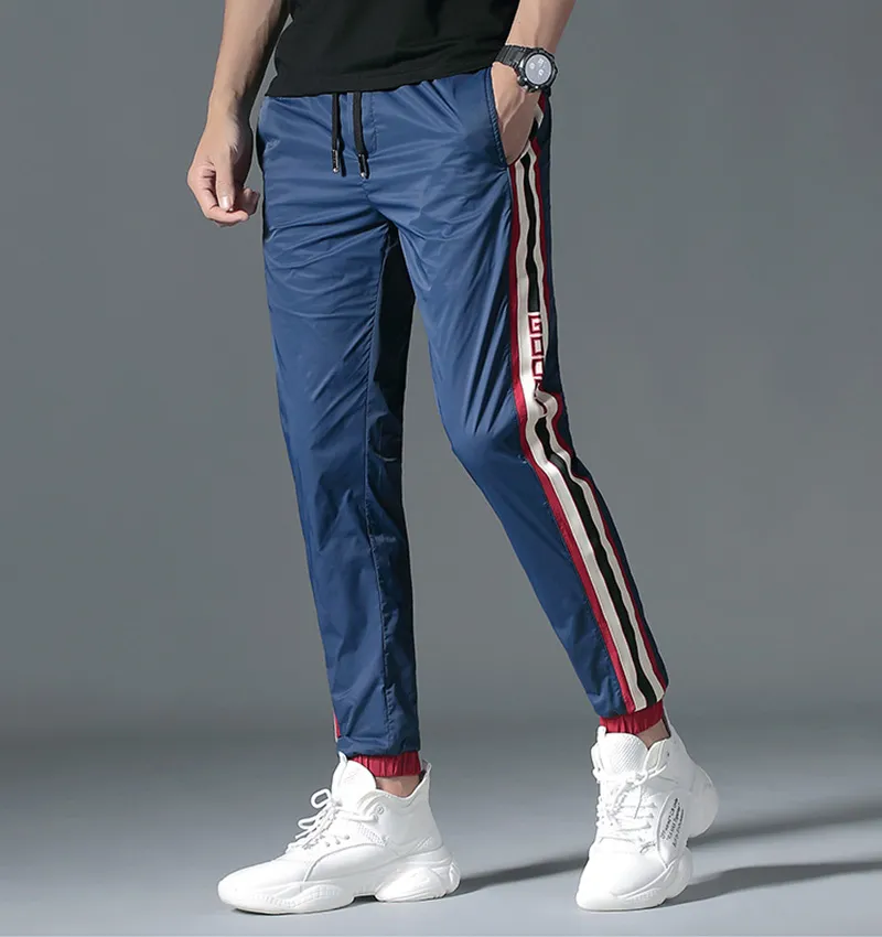 2021 Mens Breathable Jogger Pants New Drawstring Sports Track Pants Men Street Fashion Side Stripe Designer Joggers Casual Trousers M-5XL