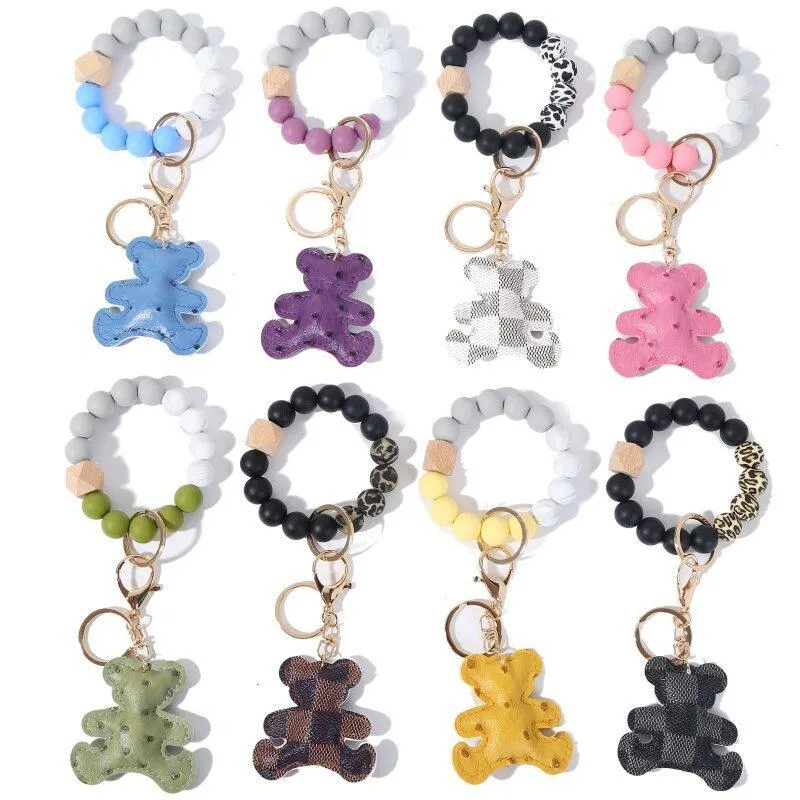 8 Styles Silicone Bead Bracelet Keychain Party Wooded Beads Keyring Old Flower Plaid Bear Decoration Key Ring PU Leather Ornament Bag Pendant DH8975