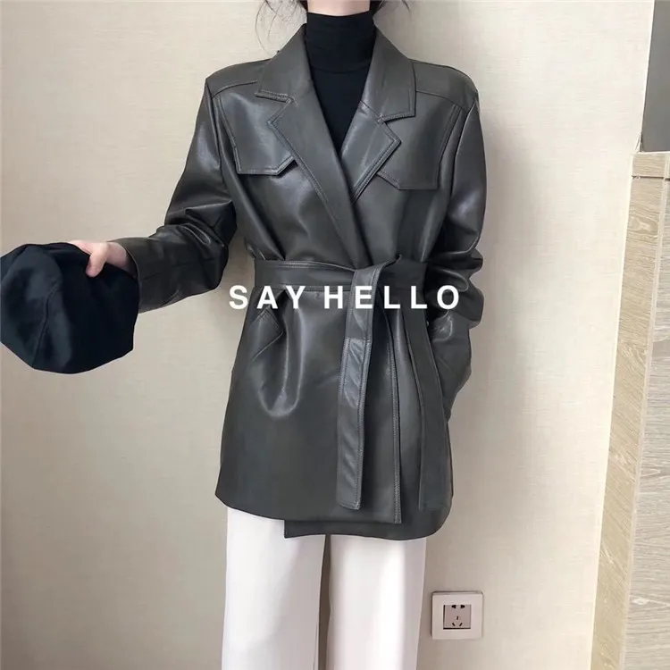 한국의 새로운 디자인 여성 회전 칼라 칼라 긴 슬리브 새시 벨트 중간 긴 PU 가죽 코트 느슨한 플러스 크기 카사 코스