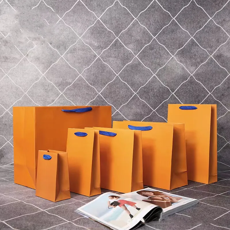 New Orange Gift Bag Coulisse V Box Borsa di stoffa Display Moda Cintura Sciarpa Abbigliamento Borse Tote Gioielli Collana Bracciale Orecchino Portachiavi Ciondolo Imballaggio al dettaglio