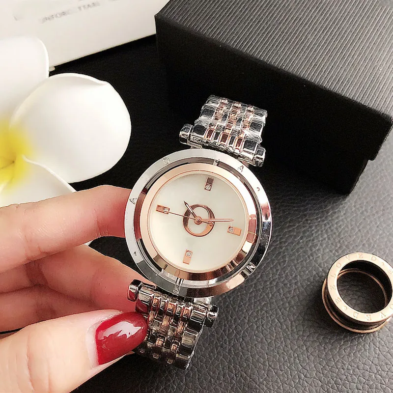 Relojes de marca de moda para mujer y niña, reloj de pulsera de cuarzo con letras grandes, esfera giratoria, banda de Metal y acero, P76290d