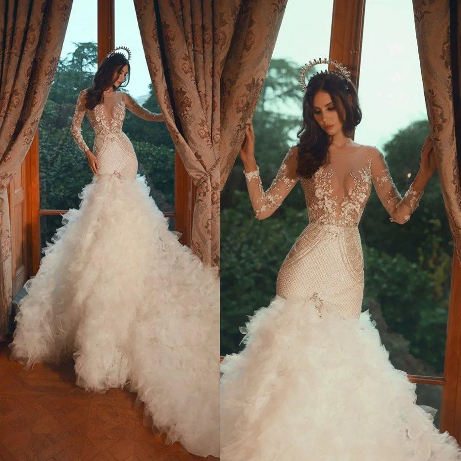 2021 Långärmade sjöjungfrubröllopsklänningar Lyxig pärlstav Lace Applique Crystals Scoop Neck Illusion Bodice Ruffle Bröllop Bridal Gown Vestido