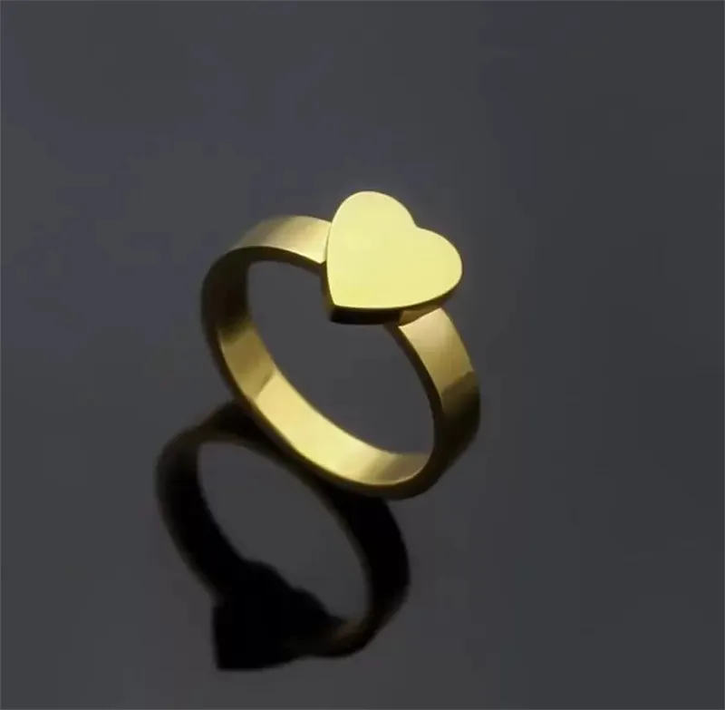 2021 de calidad superior extravagante anillo de corazón simple oro plata rosa colores acero inoxidable pareja anillos moda mujer diseñador joyería señora fiesta regalos