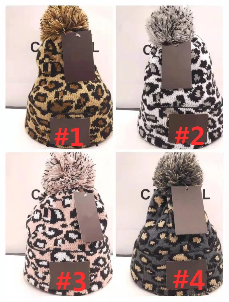 Leopard Print Label Hat Treamen Thereen Women Bonnet Bonnet مع Pompoms Raccoon Fur Pompoms Warm Girl Caps Pompon Beanie Tie Ball Hats