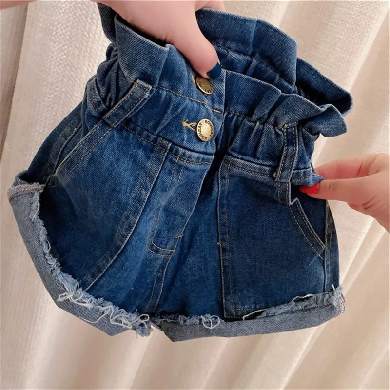 2020 Denim Kid Pants Summer Ruffle High Cintura Jean Shorts Pocket Girls Botón Elástico Borla Niños Vaquero Pantalón Moda Azul 22hh G2