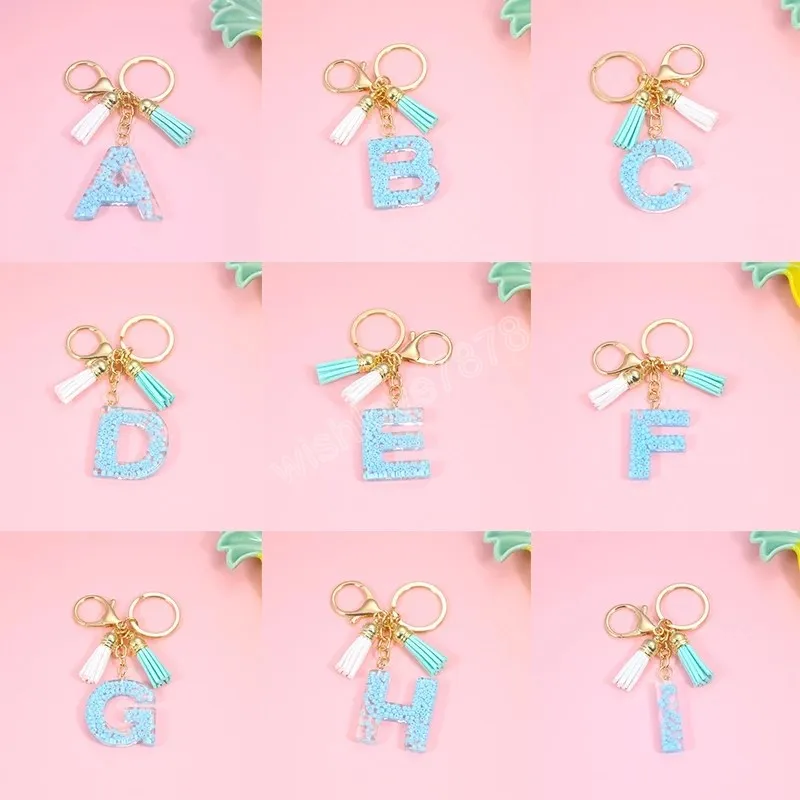 Utsökt 26 bokstäver harts nyckelringar Charms för kvinnor Beaded Alphabet Handväska Ornaments Tillbehör Tassel Key Rings