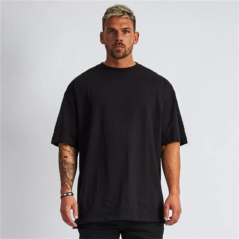 Mens Loose Oversized Fit Short Sleeve T-shirt med tappad axel Retro Fitness T Shirt Summer Gym Bodybuilding Tops Tees 210706