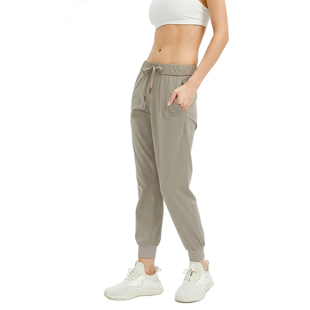 Pantaloni da yoga a vita alta Pantaloni sportivi da donna ad asciugatura rapida Abbigliamento sportivo con coulisse Donna Palestra Sport Leggings da corsa fitness larghi casual