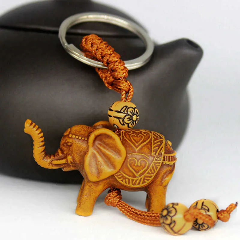 1 st Elephant Keychain Peach Wood Carving Unik nyckelkedja för att ge gåvor Pom Söt Keychain Rostfritt stål G1019