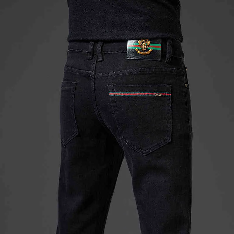الشتاء الخريف الرجال جينز مرونة متوسطة الخصر الصغيرة مستقيم أنبوب العلامة التجارية الأسود الكورية