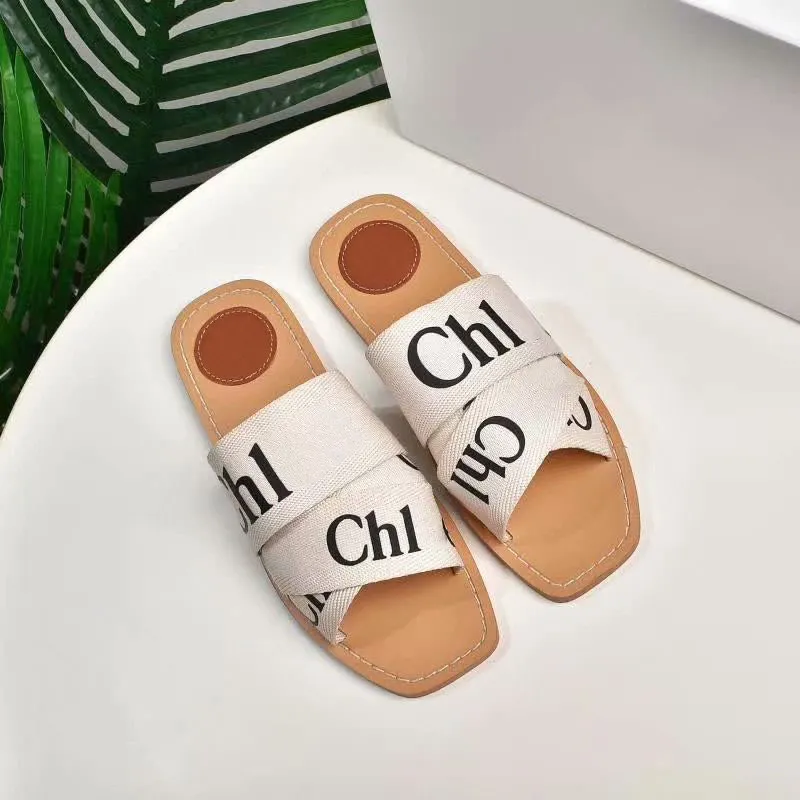 2021 diseñador Mujer Woody Mules Fflat Zapatillas Slide Sandal Deisgner Lady Lettering Fabric Exterior Cuero Suela Diapositivas Sandalias con caja