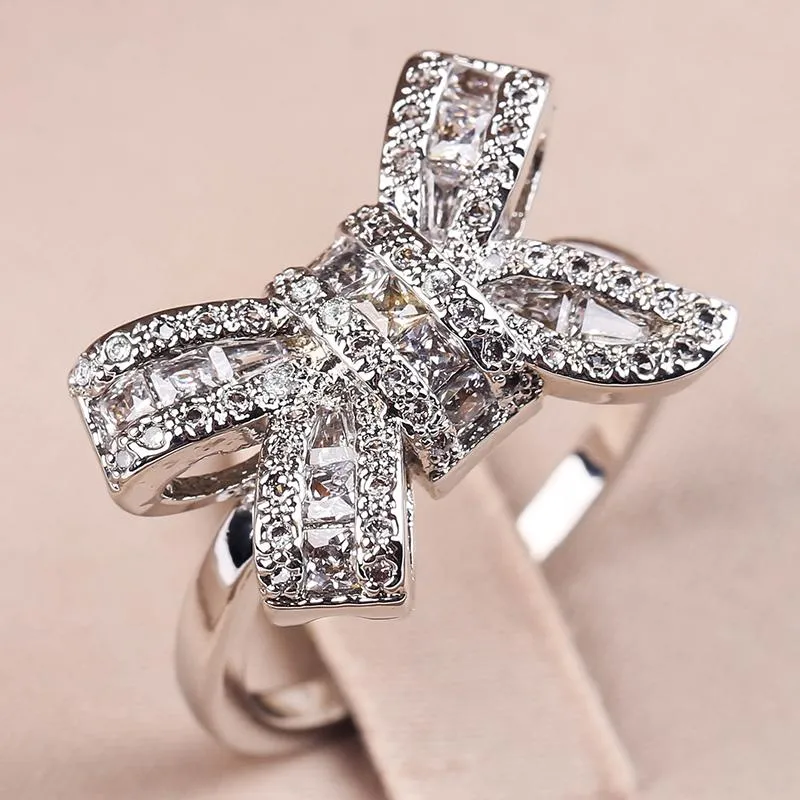 Alyanslar zarif parlak gümüş kaplama beyaz zirkon yüzüğü bowknot tasarım bow için kadın parti mücevher hediye anillos mujer b4m153