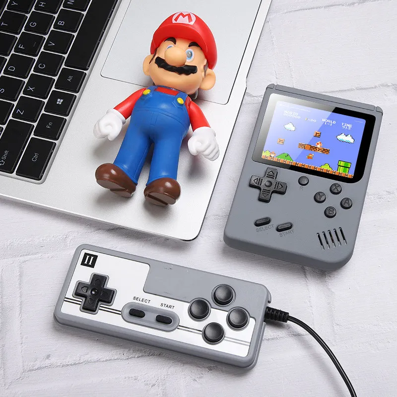 Nyaste bärbara Macaron handhållna videospelsspelare kan lagra 800 typer av spel Retro spelkonsol 3,0 tum färgglad LCD-skärm med logotyp
