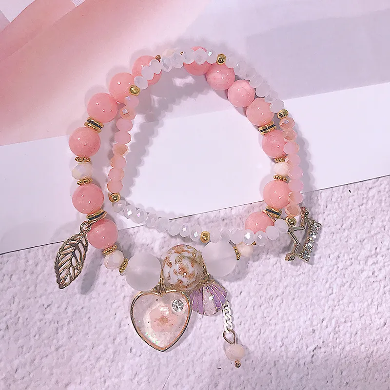 Koreanischer süßer Meer Urlaub Stil Armband Mode Stretch Rosa Kristall Perlen Kleine frische Hand Schmuckmädchen