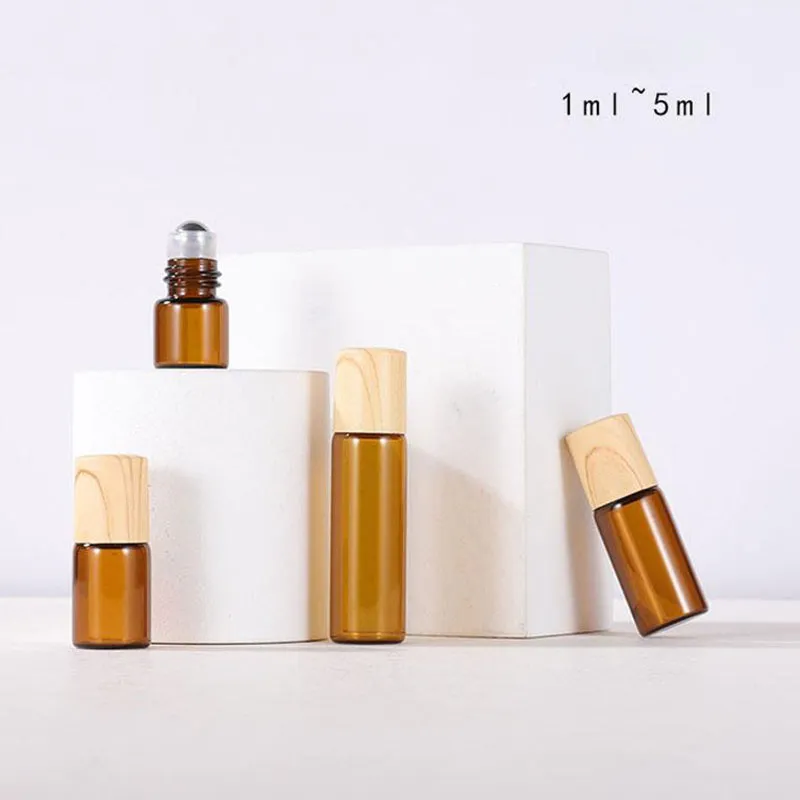 エッセンシャルオイル香水のための1ml 2ml 3ml 5mlの金属のローラーボール瓶のための油の油びんは、プラスチック製の木製の穀物の帽子とバイアルの上にロールされています