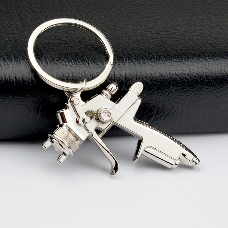 Ny Vatten Spray Gun Keychain Handväskor Män Kreativ bilväska Nyckelring Tillbehör Hängsmycke Användbara Key Chains C3