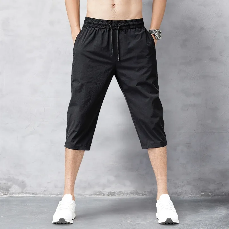 Pantalones cortos para hombres Pantalones de verano Pantalones delgados de nylon 3/4 de longitud Pantalones masculinos Bermudas Tablero de secado rápido Playa Pantalones cortos largos para hombres negros 210316