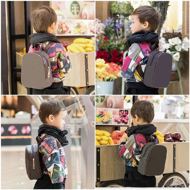 Hot Sell Barn Ryggsäckar Fashion High Quality PU Shoulders Väskor Kindergarten Baby Boys Girls School Bag Classic Printing Book Paket