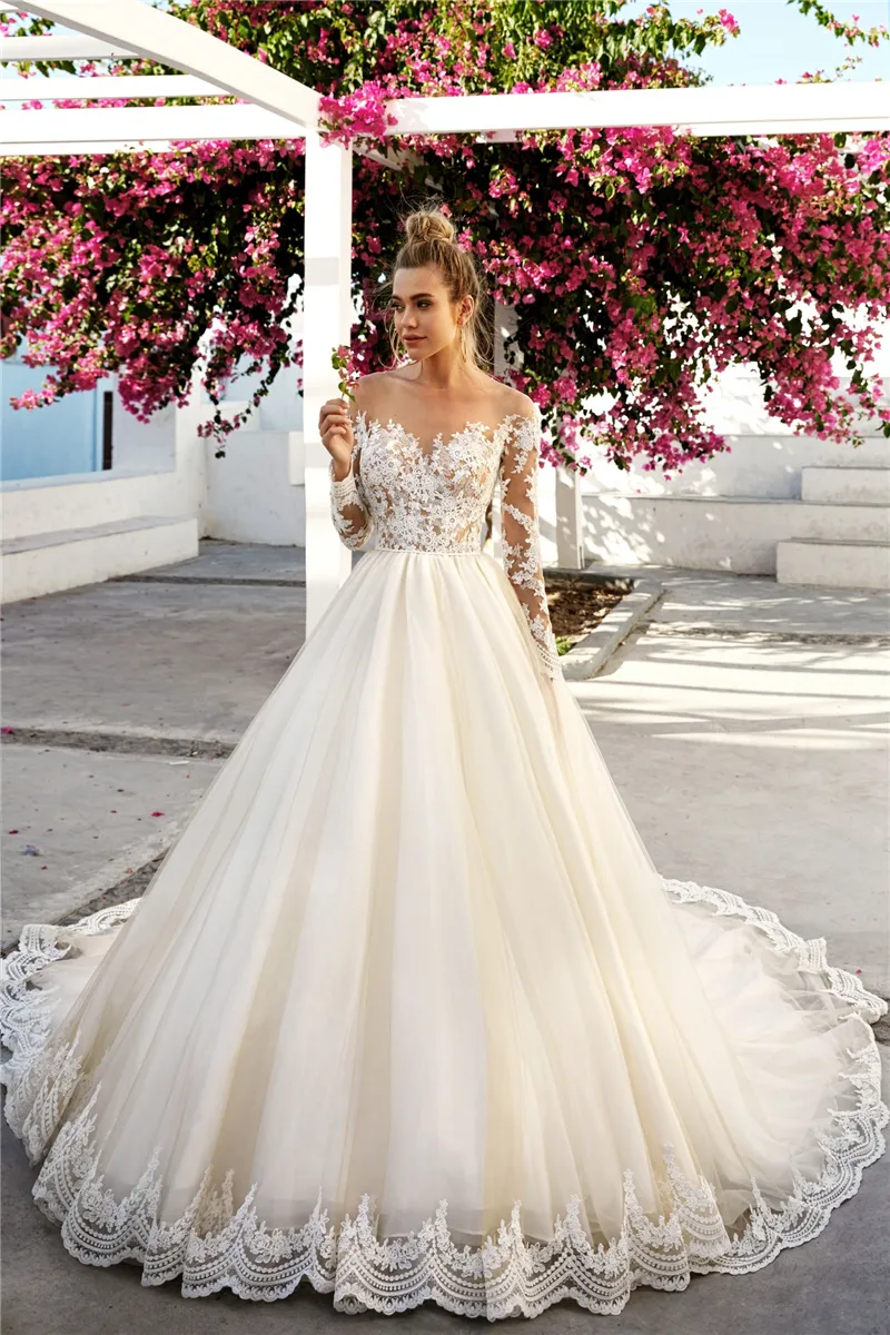 Romantyczna linia Suknie ślubne Suknie ślubne z długim rękawami Sheer Neck Lace Aplikacje Light Champagne Tulle Bride Dress Dress Illusion Back Buttons 2022 Wiosna