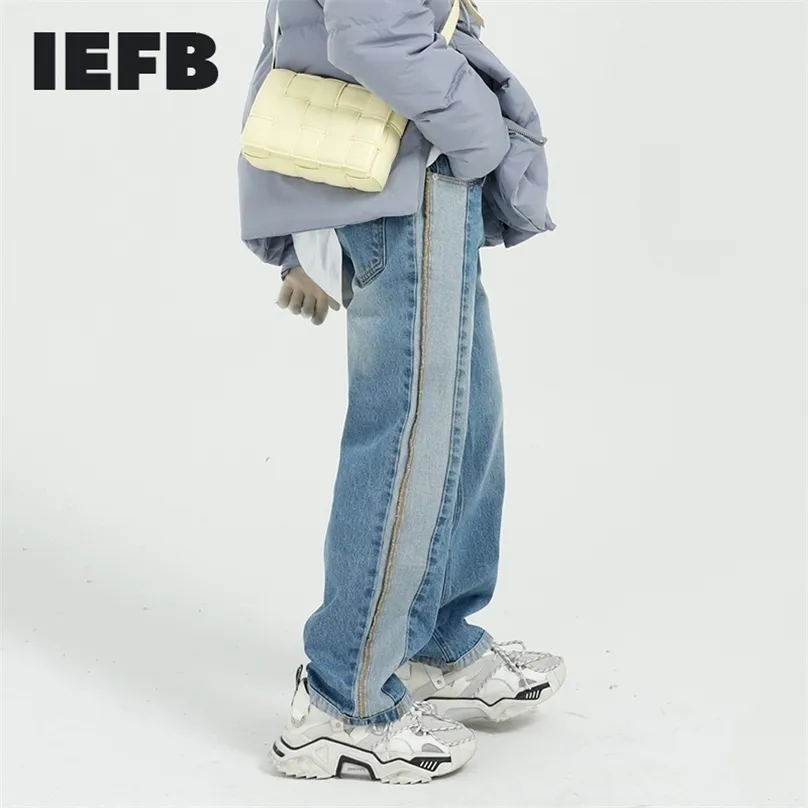 IEFB Mäns Slitage Färg Block Patchwork Blå Jeans Vår Koreanska Streetwear Design Tvättade Denim Straight Loose Byxor 210716