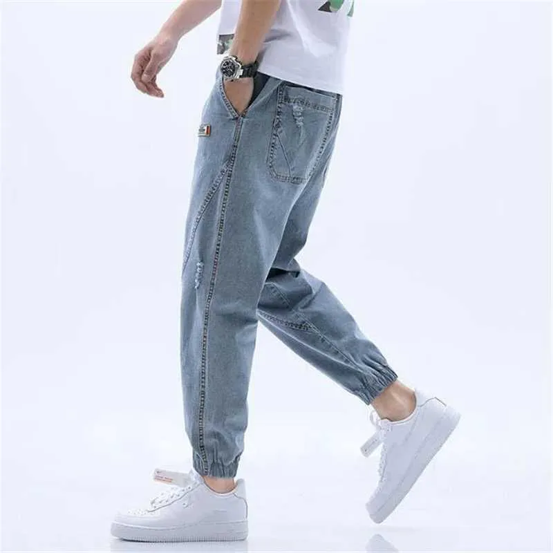Yeni Moda Çizik Delik Kot Erkekler Bahar Sonbahar Rahat Harem Pantolon Erkek Yıkanmış Denim Pantolon Elastik Bel 3XL 4XL Y0927