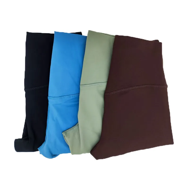 L-037B Medias de tiro alto Pantalones de yoga de color sólido con mallas elásticas de línea en T Pantalones de chándal de sensación desnuda Pantalones de mujer con bolsillo en la cintura