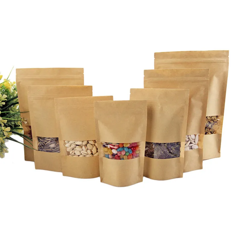 100pcs / lot Stand Up Kraft Paper Bag Pochettes de scellage réutilisables avec des sacs de stockage de fenêtre transparents transparents pour les noix de café séchées