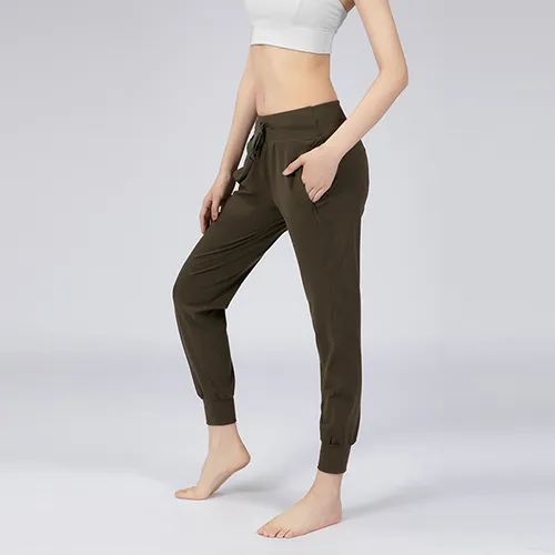 Pantaloni da jogging con due tasche laterali Pantaloni da yoga Pantaloni sportivi da allenamento elasticizzati da corsa con