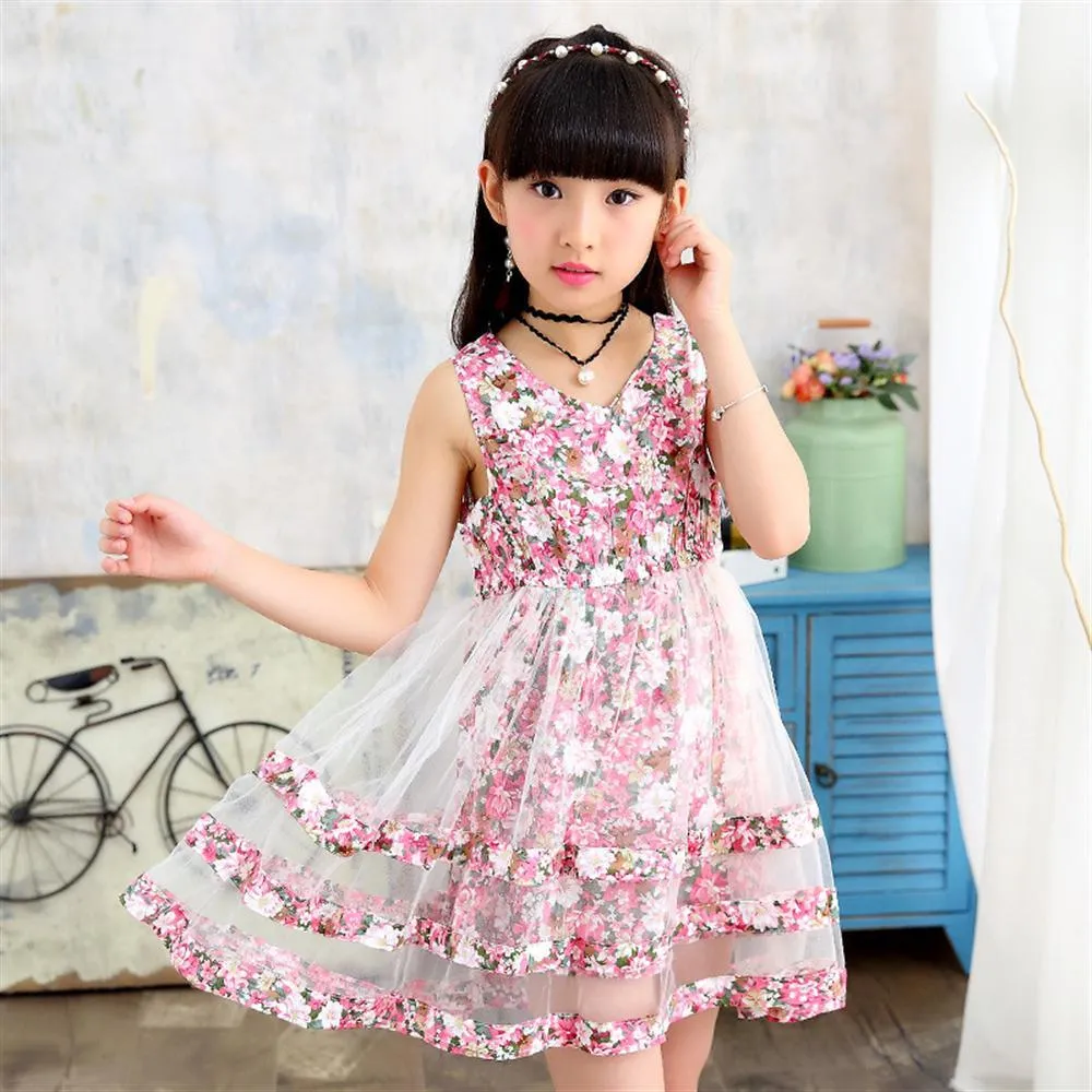 Summer portrait of 8-9 year old little girl wearing grey dress and purple flip  flops Stock Photo