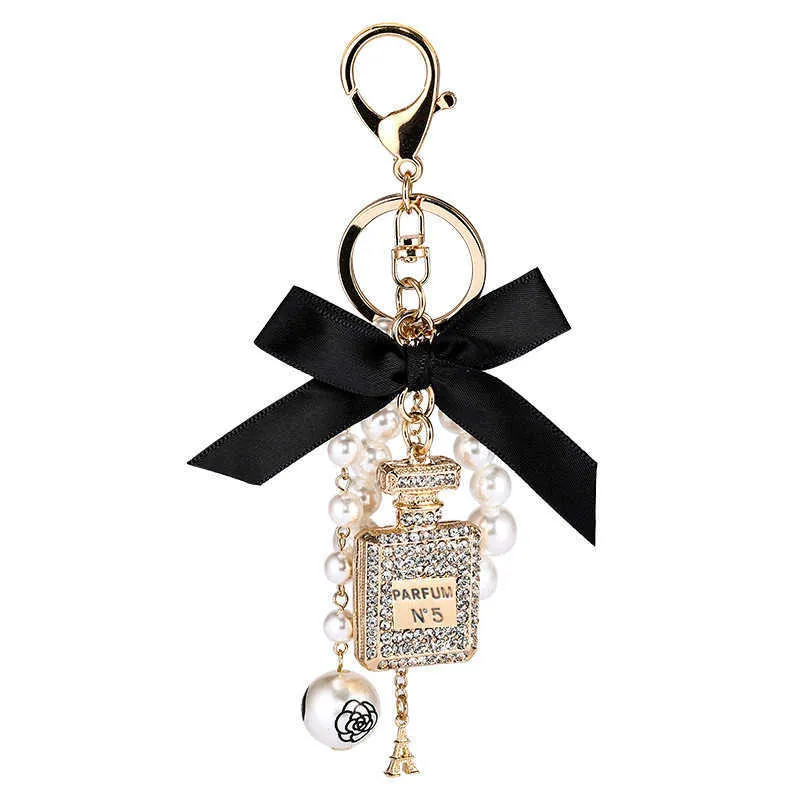 Fashion Pearl Perfume Bottle Keychain Car Key Ring Femme Sac Charm accessoires Accessoires Couche Key Key Chain Creative Keyrings G1019