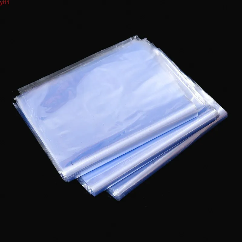 100pcs / mycket transparent pvc värme krymp plastpåse paket wrap film hushålls krympbara livsmedelsbutik skor kosmetika lagringshög quatity